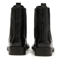 Chaussons noirs à effet froissé.Ce produit taille grand.