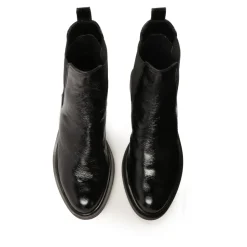 Chaussons noirs à effet froissé.Ce produit taille grand.