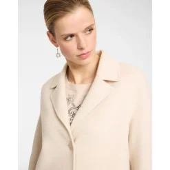 Manteau en tissu double avec revers, boutonnières et poches