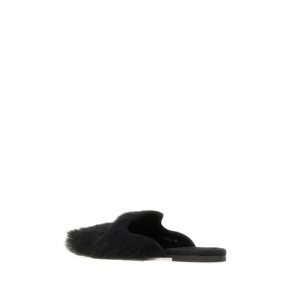 Mules en shearling et daim
