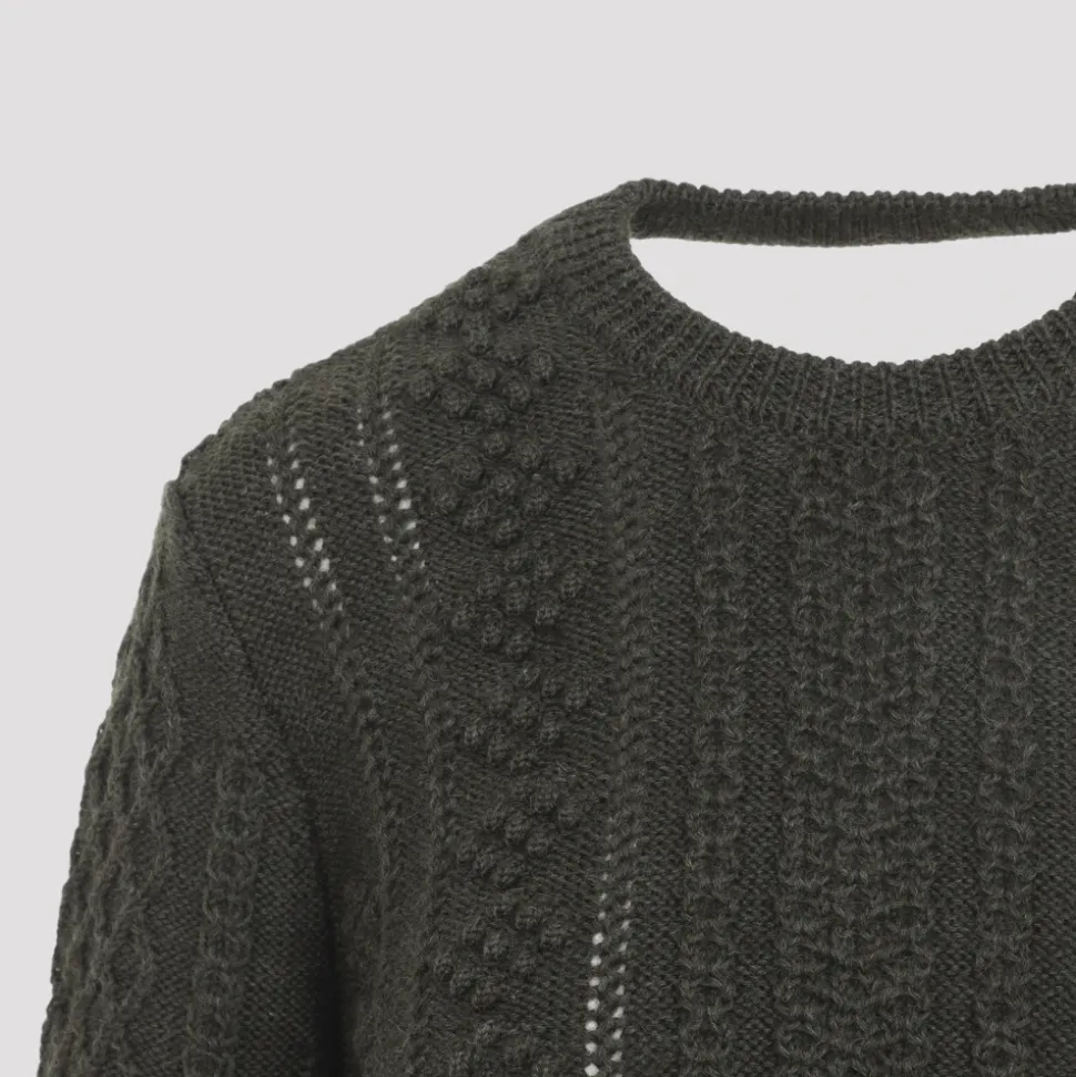 Pull court en maille torsadée